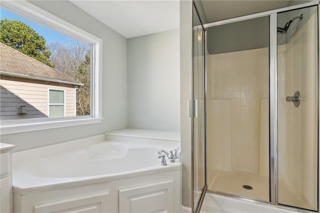 bathroom with separate shower and tub