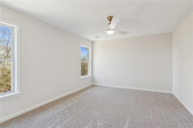 carpeted empty room with ceiling fan