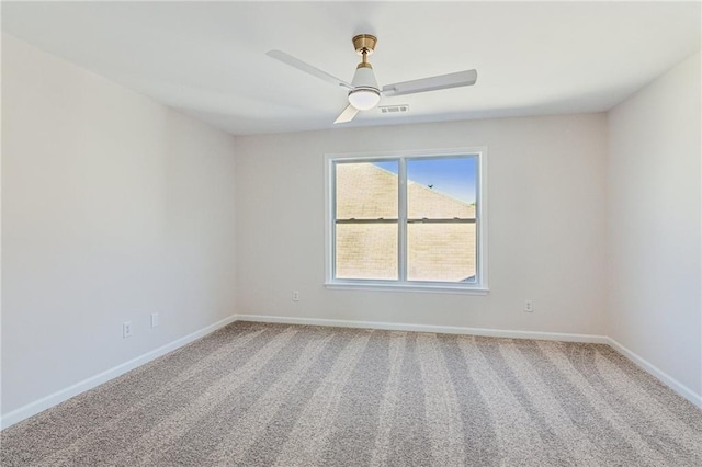 carpeted empty room with ceiling fan