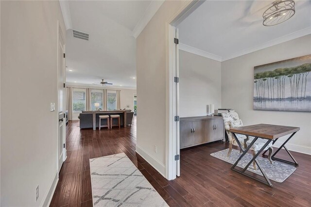 hallway featuring ornamental molding, wood finished floors, baseboards, and recessed lighting
