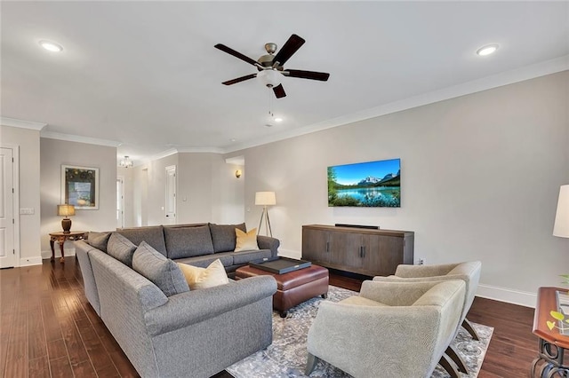 living area with baseboards, a ceiling fan, crown molding, recessed lighting, and dark wood-style flooring