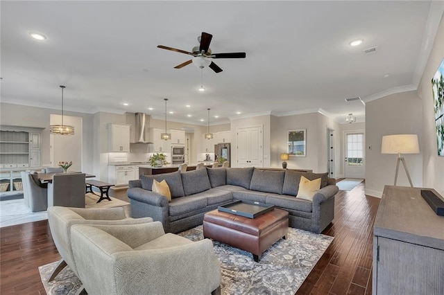 living area with ceiling fan, dark wood-style floors, recessed lighting, baseboards, and crown molding
