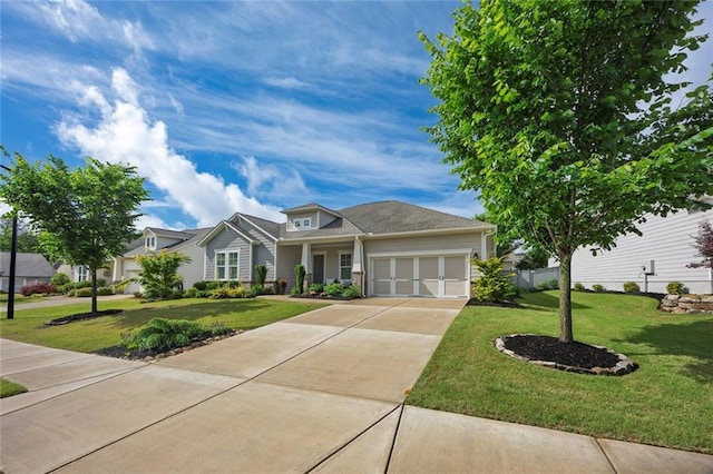 view of front facade with an attached garage, a front lawn, and driveway