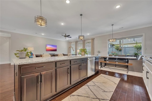 kitchen with stainless steel dishwasher, a sink, open floor plan, dark wood-style flooring, and recessed lighting