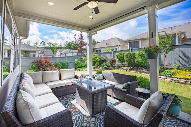view of patio / terrace featuring a fenced backyard, an outdoor hangout area, ceiling fan, and a residential view