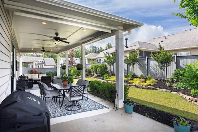 view of patio / terrace with outdoor lounge area, a fenced backyard, ceiling fan, grilling area, and outdoor dining space