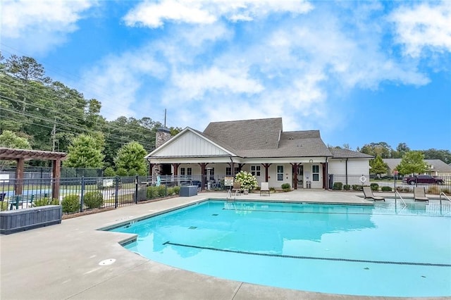 community pool featuring fence, a patio, and a pergola