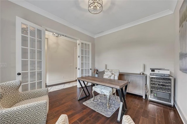 office with french doors, ornamental molding, wood finished floors, and baseboards