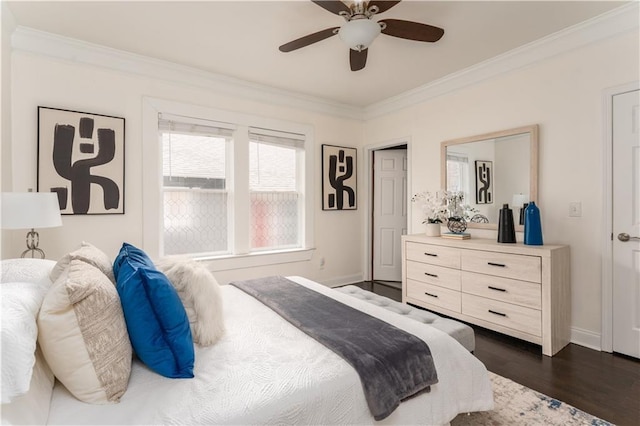 bedroom featuring ceiling fan, dark wood-type flooring, baseboards, and ornamental molding