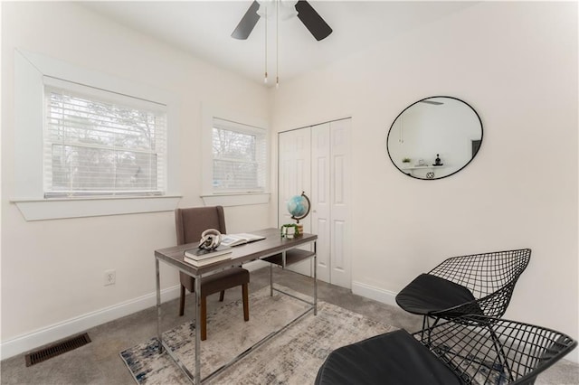 office area featuring ceiling fan, carpet, visible vents, and baseboards