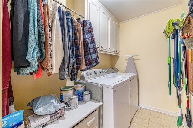 washroom featuring cabinet space, independent washer and dryer, and baseboards