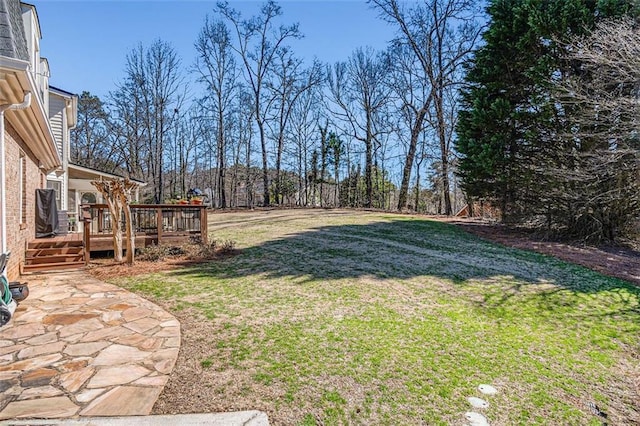 view of yard with a patio area and a deck