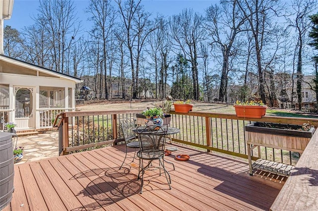 deck with a sunroom