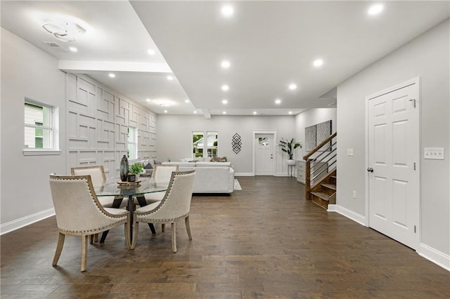 dining space featuring dark wood-type flooring