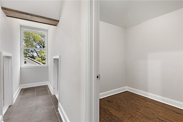 interior space with vaulted ceiling with beams and wood-type flooring