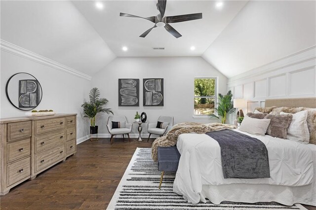 bedroom with vaulted ceiling, ceiling fan, and dark hardwood / wood-style flooring