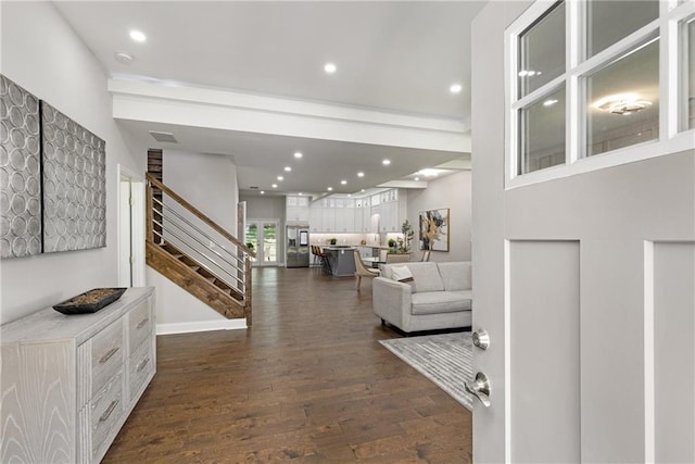 entryway with dark hardwood / wood-style flooring