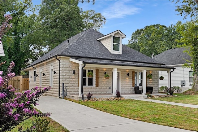 view of front of home featuring a porch and a front yard