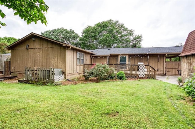 back of property with a wooden deck