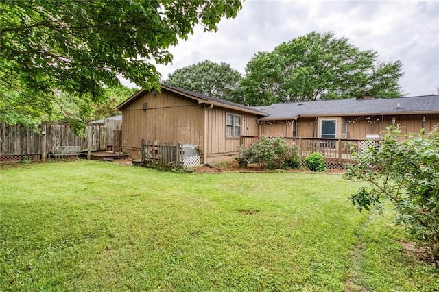 view of side of home with a deck
