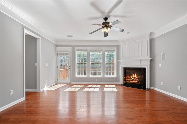 1530 Wehunt Cir SE Unit 19, Smyrna, GA 30082 - unfurnished living room featuring wood finished floors, a large fireplace, ceiling fan, and crown molding