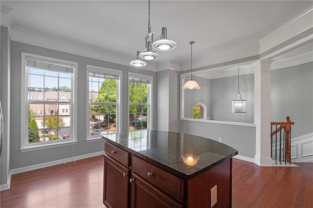 1530 Wehunt Cir SE Unit 19, Smyrna, GA 30082 - kitchen with dark stone countertops, a chandelier, ornamental molding, and dark wood-style flooring