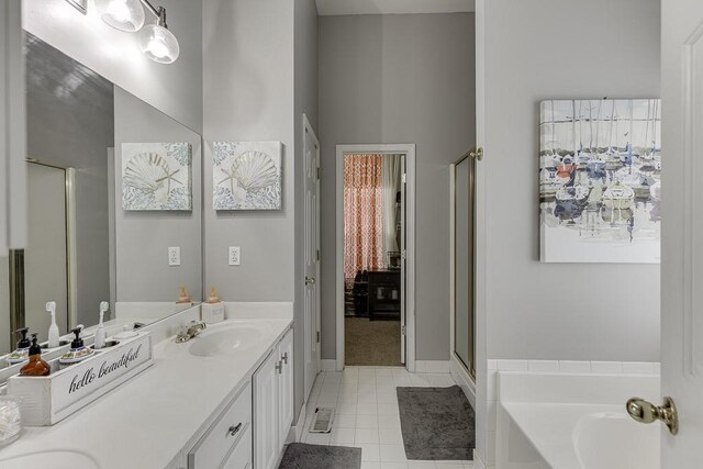 1045 Legacy Walk, Woodstock, GA 30189 - full bath featuring tile patterned flooring, a shower stall, double vanity, a bath, and baseboards