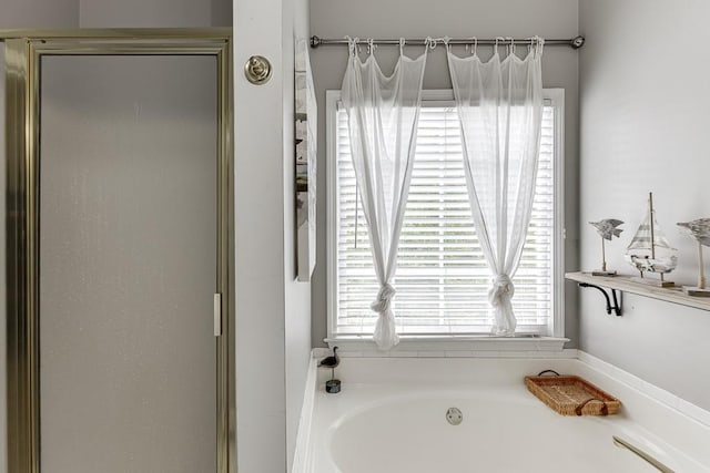 1045 Legacy Walk, Woodstock, GA 30189 - bathroom with a garden tub and a stall shower