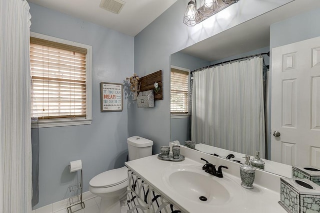 1045 Legacy Walk, Woodstock, GA 30189 - bathroom with toilet, vanity, baseboards, and curtained shower
