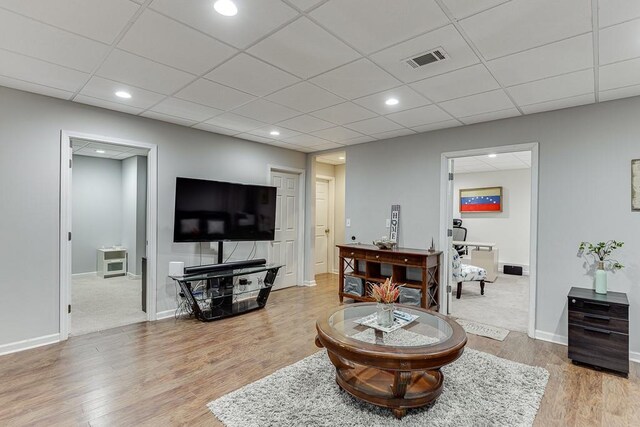 1045 Legacy Walk, Woodstock, GA 30189 - living room with wood finished floors, baseboards, recessed lighting, and a drop ceiling