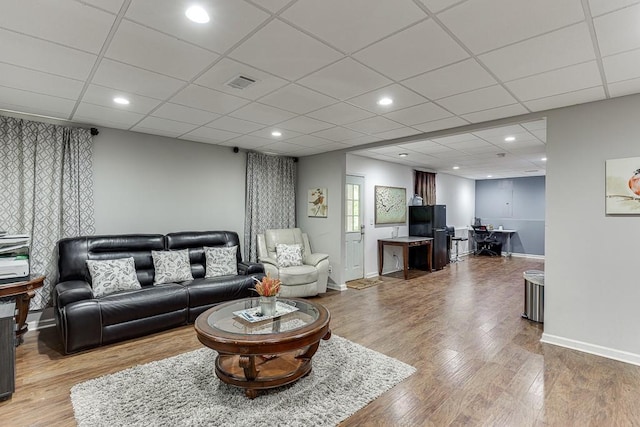 1045 Legacy Walk, Woodstock, GA 30189 - living room with wood finished floors, baseboards, recessed lighting, and a drop ceiling