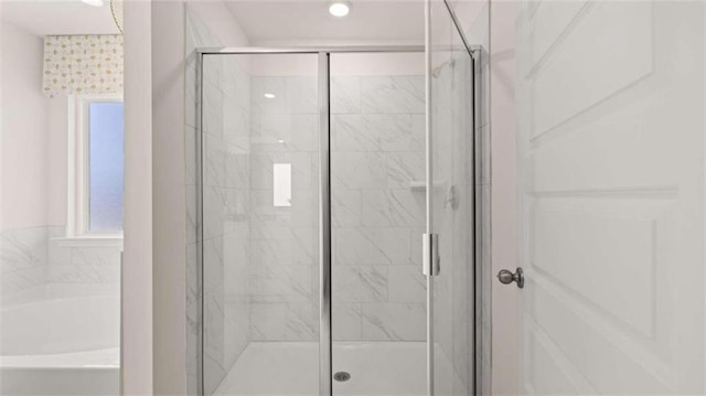 bathroom featuring plus walk in shower