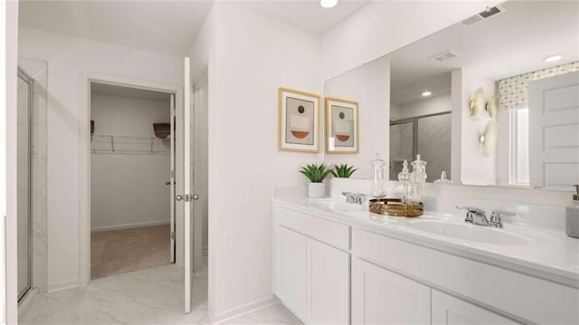 bathroom featuring vanity and walk in shower