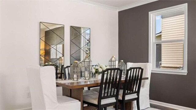 dining area featuring crown molding