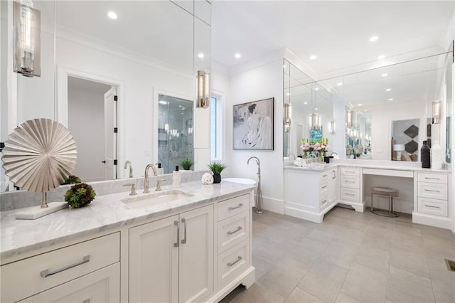 bathroom featuring crown molding, vanity, and a shower with shower door