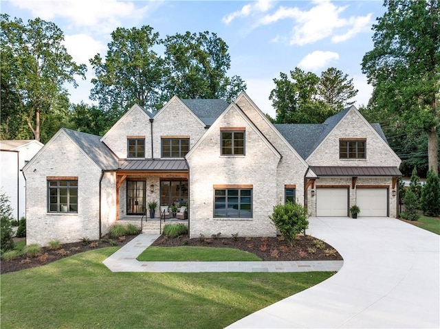 view of front of house with covered porch and a front lawn