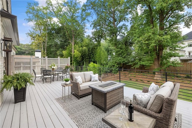 wooden deck featuring an outdoor hangout area