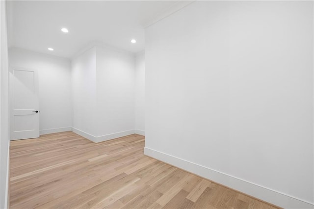 spare room featuring light hardwood / wood-style flooring