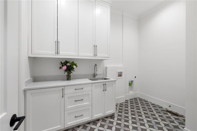 washroom with sink, cabinets, washer hookup, electric dryer hookup, and crown molding