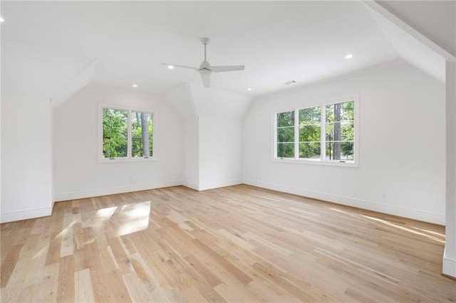 additional living space with light hardwood / wood-style floors, ceiling fan, and lofted ceiling