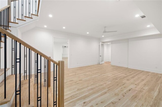 interior space with light hardwood / wood-style flooring, ceiling fan, and crown molding