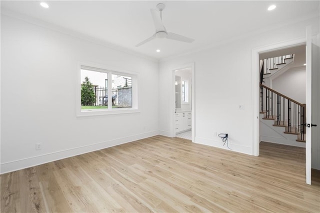 unfurnished bedroom featuring light wood-type flooring, ceiling fan, crown molding, and connected bathroom