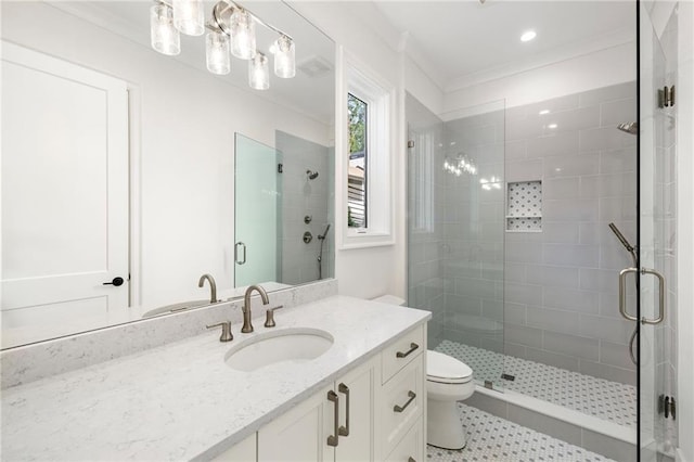 bathroom featuring crown molding, toilet, vanity, and walk in shower