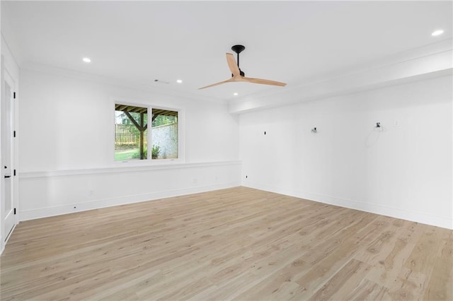 empty room with ceiling fan, light hardwood / wood-style flooring, and crown molding