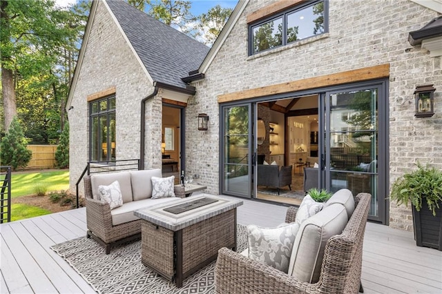 wooden terrace featuring an outdoor hangout area