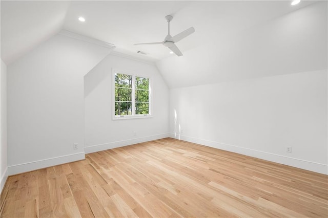 bonus room with light wood-type flooring, ceiling fan, and lofted ceiling