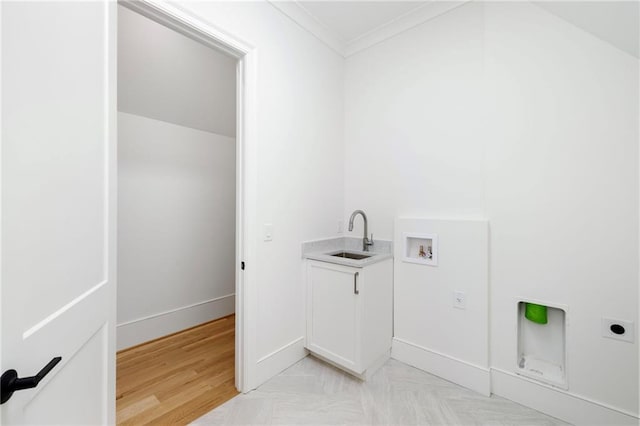 laundry area featuring crown molding, sink, hookup for a washing machine, light wood-type flooring, and hookup for an electric dryer