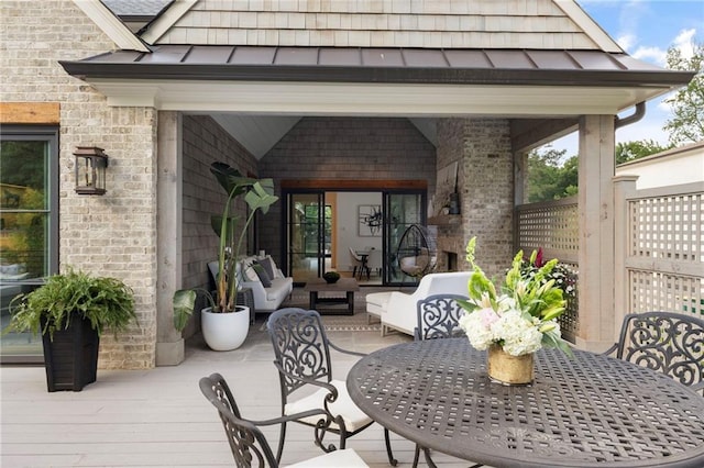 view of patio with an outdoor living space and a wooden deck