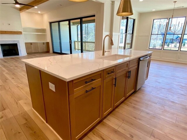 9224 Waldrip Rd, Gainesville, GA 30506 - kitchen with a sink, stainless steel dishwasher, light wood finished floors, ceiling fan, and pendant lighting