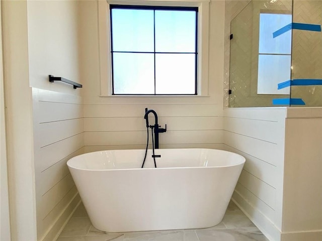 9224 Waldrip Rd, Gainesville, GA 30506 - bathroom with a freestanding bath and tile patterned flooring
